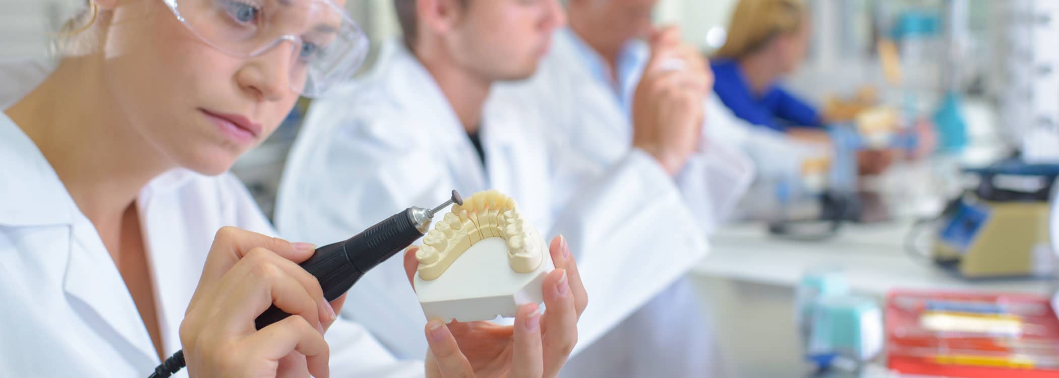 Image of professionals making dentures.